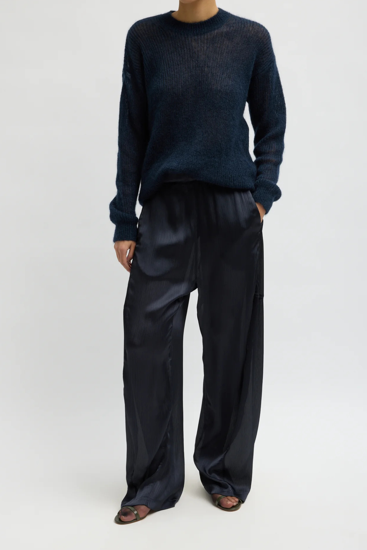Tibi Matte Satin Plisse Winslow Pant in navy, featuring textured matte satin plissé and a fluid silhouette.
