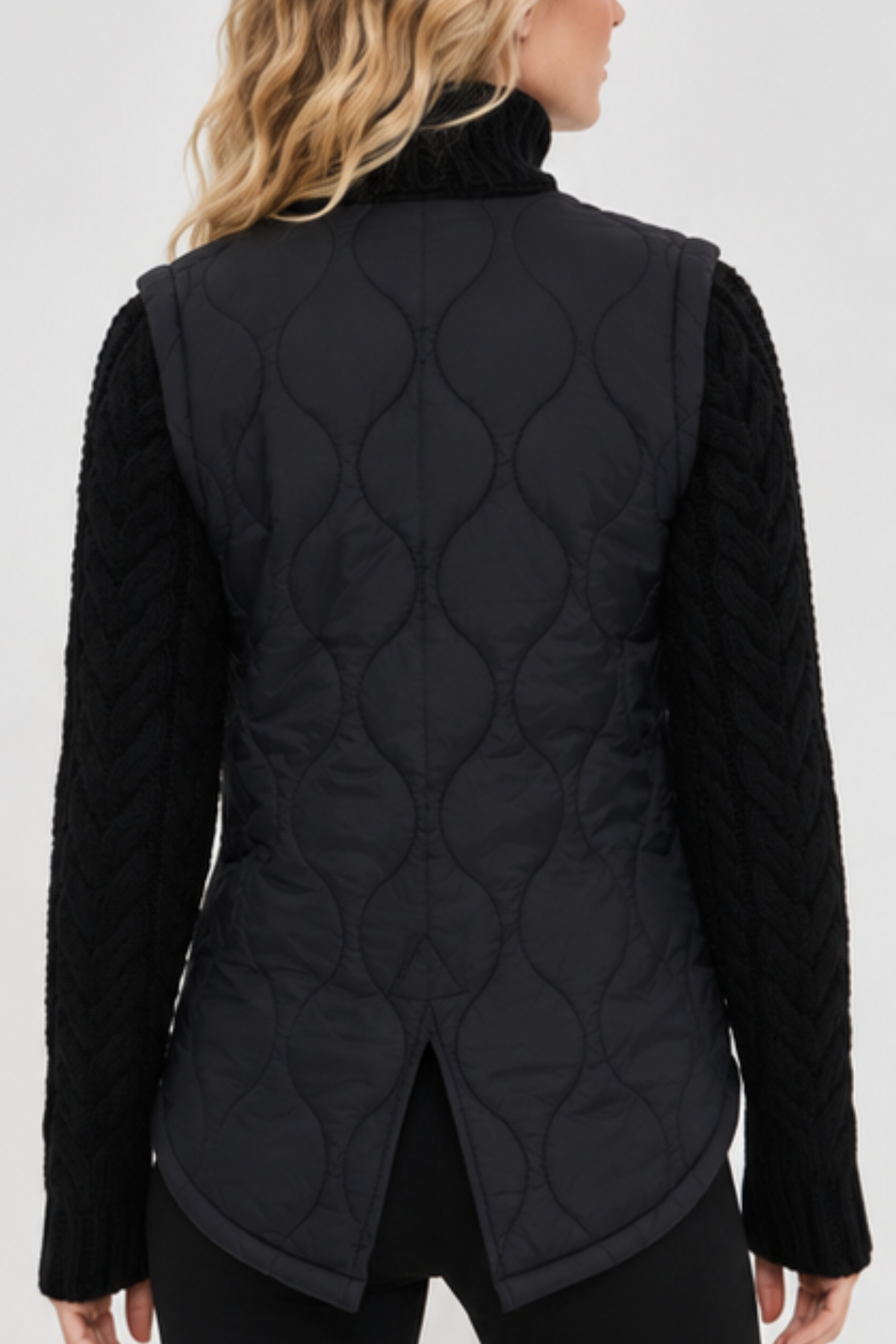 Patra black quilted jacket with wool-blend cable-knit sleeves and high-low hem