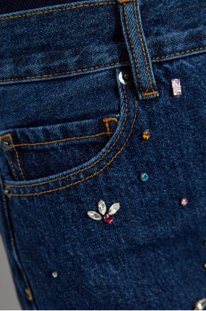 Vaqueros barril con adornos azules de autorretrato