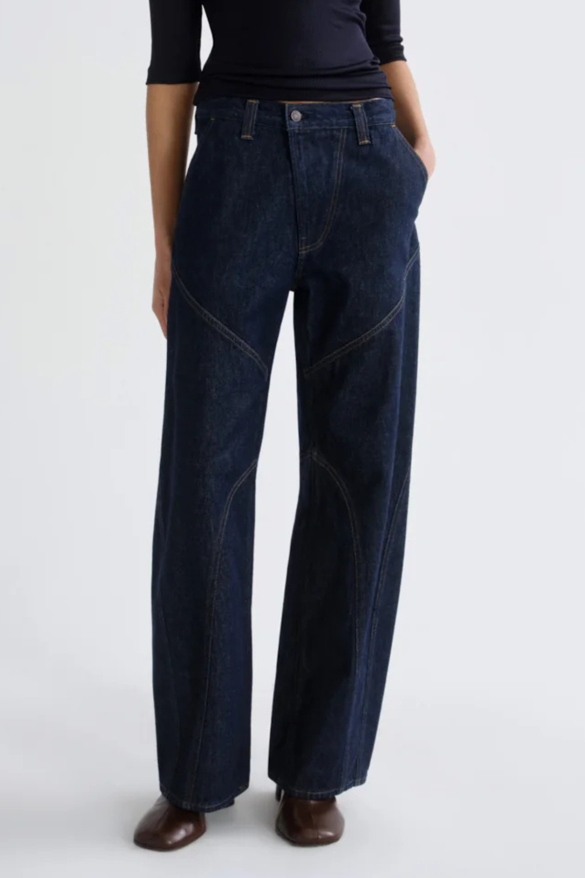 AGOLDE Reena Jeans in Rinse, featuring deep indigo regenerative cotton denim, curved seam detailing and a relaxed straight-leg silhouette.