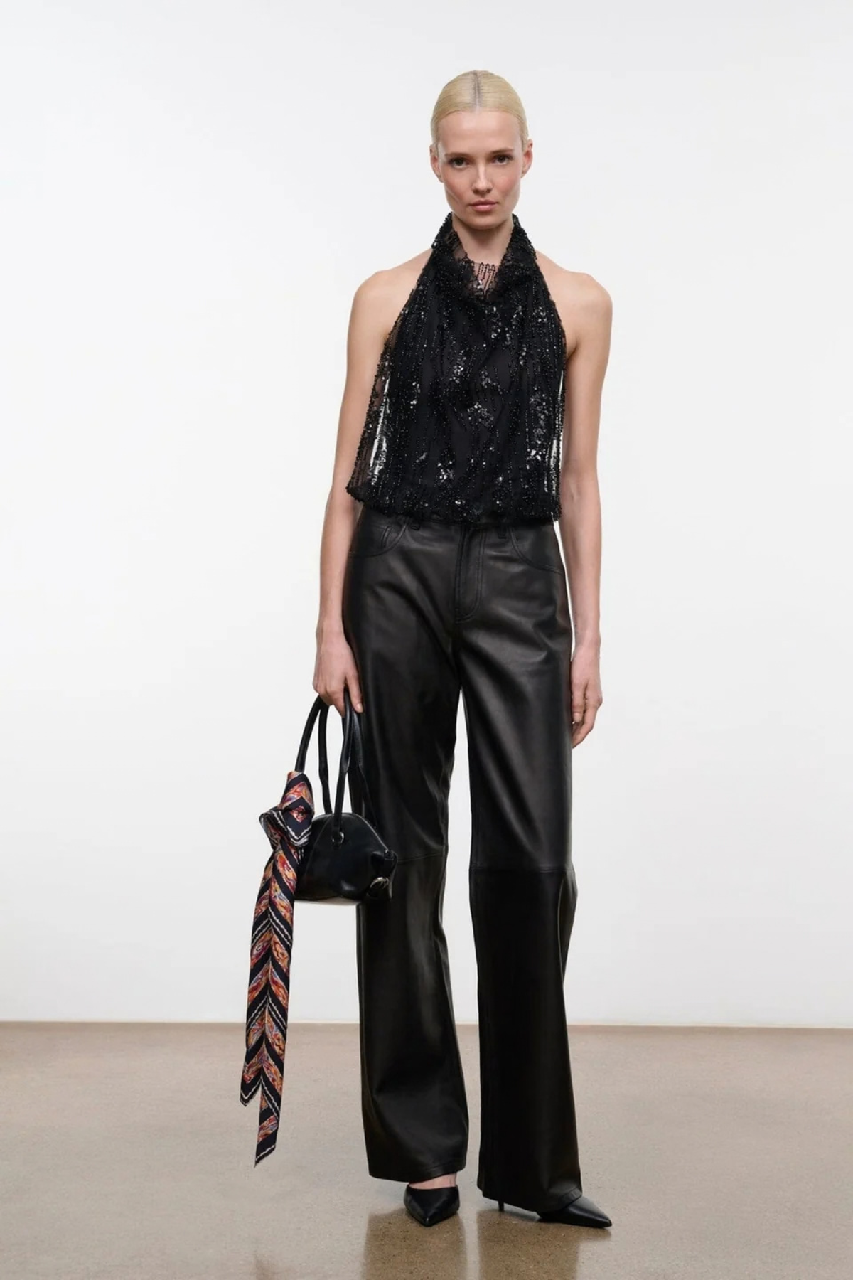 STAUD Monty Boot in Black leather with pointed toe and Western-inspired curved shaft