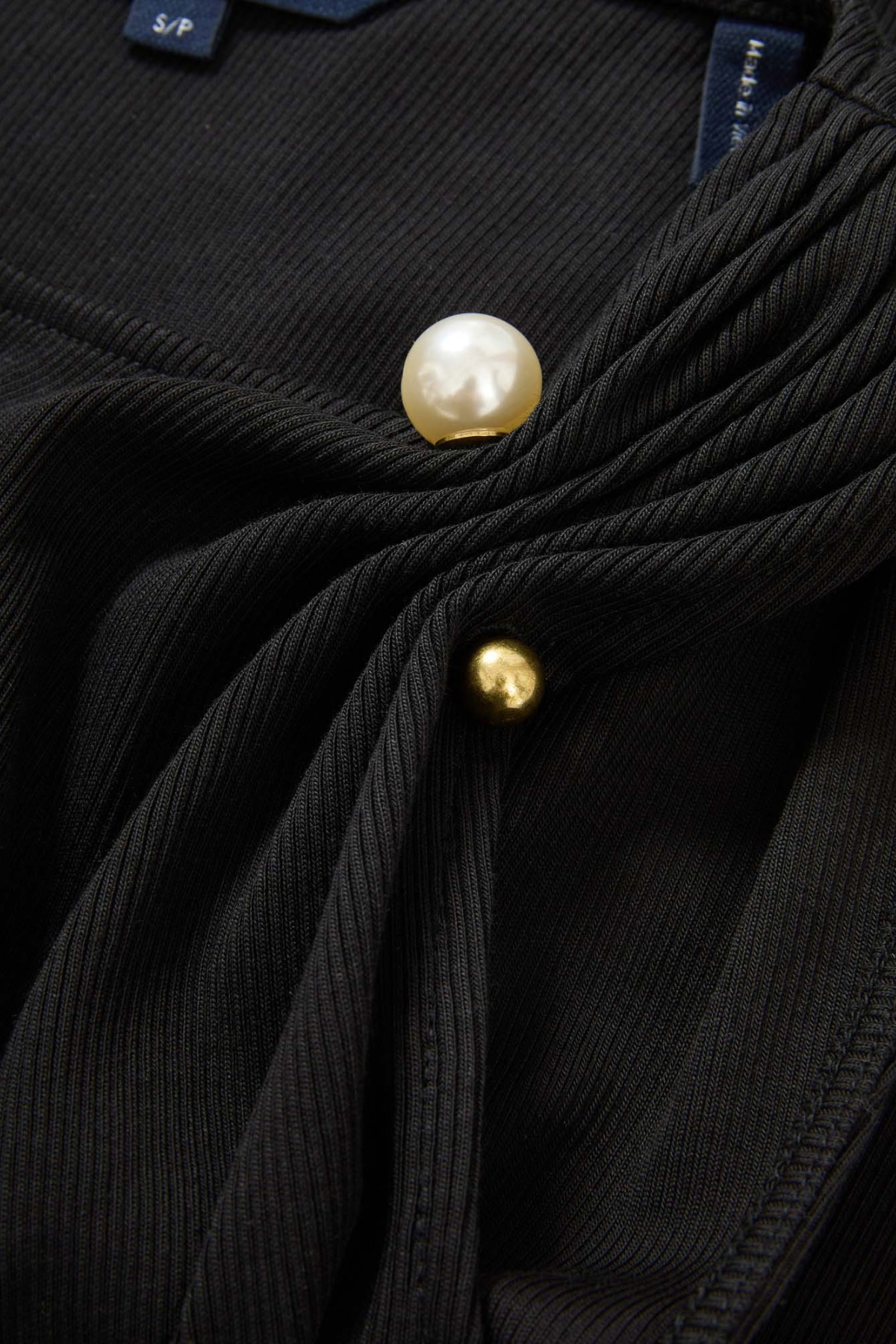 Veronica Beard Deylin Top in Black ribbed Pima cotton sleeveless top with statement brooch
