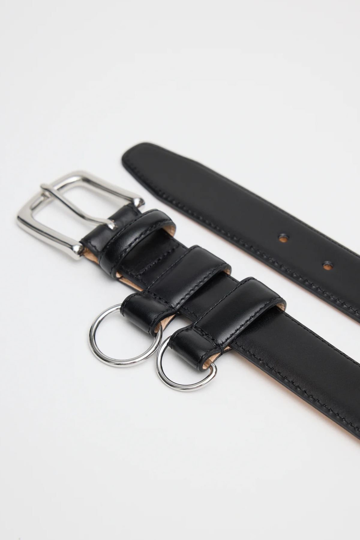 Tibi Classic Ring Hardware Leather Belt in Black with silver-tone buckle and removable D-ring loops