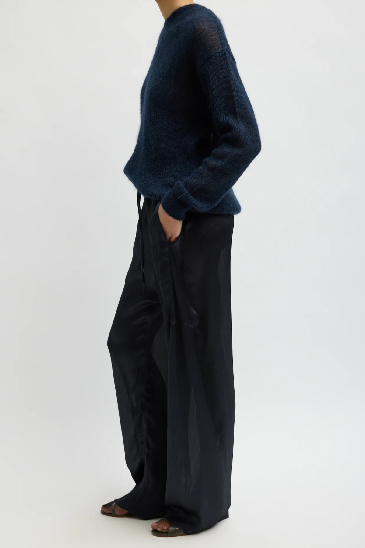 Tibi Matte Satin Plisse Winslow Pant in navy, featuring textured matte satin plissé and a fluid silhouette.